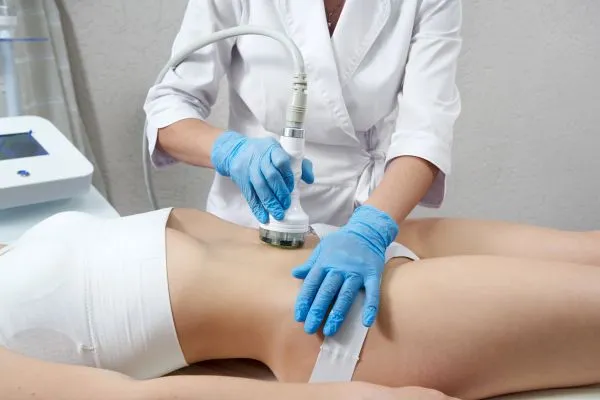 Lost the Weight but Not the Loose Skin? 2 woman having HIFU treatment on her stomach to combat loose skin Iver following weight loss